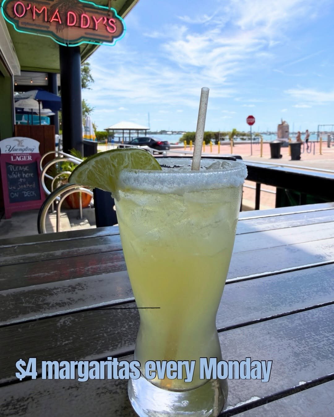 A sugar-rimmed margarita on O'Maddy's deck rail