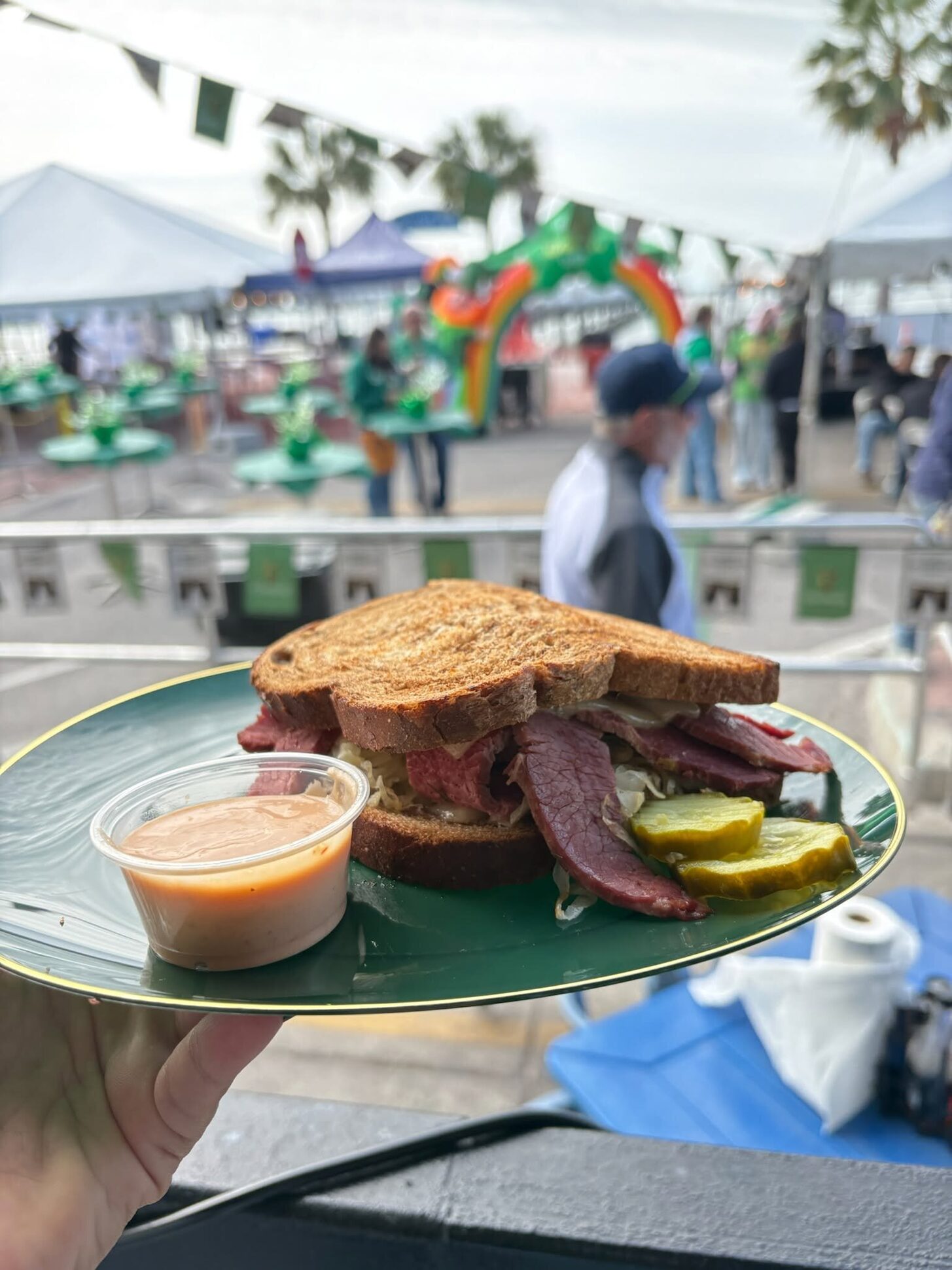 A Reuben on a plate at an O'Maddy's street festival