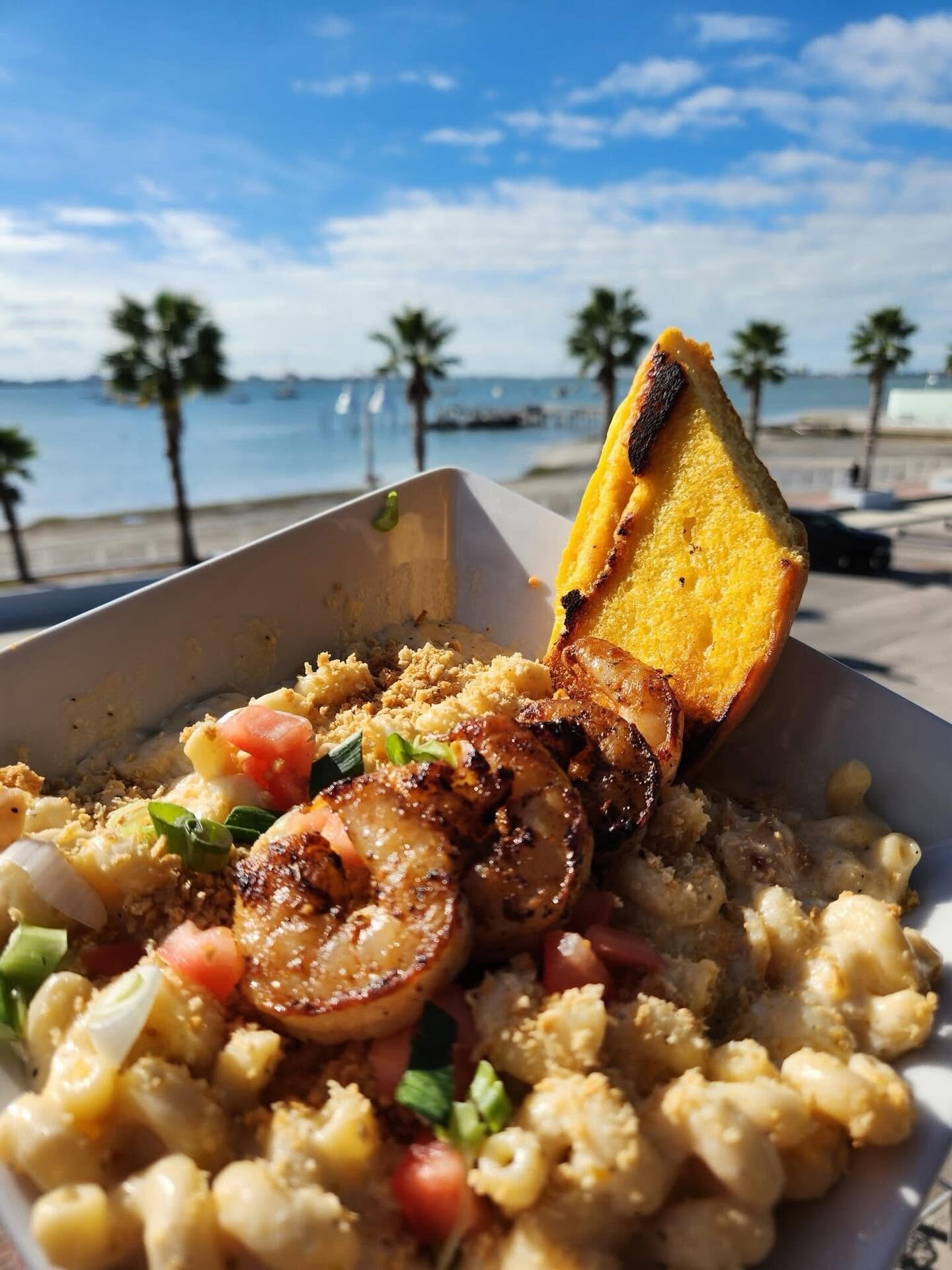 Shrimp mac and cheese at O’Maddy’s, palms and the bay behind