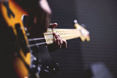 A bass guitarist performing live at O'Maddy's